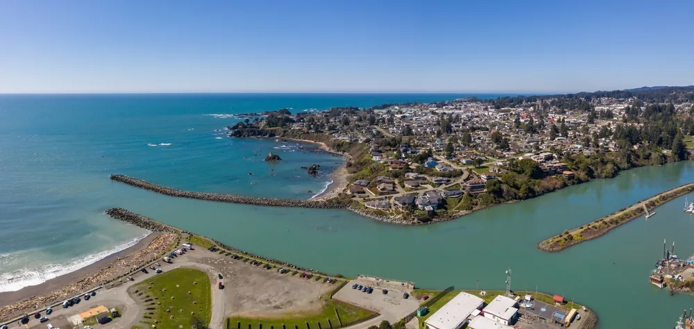 Aerial drone panorama of Brookings Oregon harbor and jetty